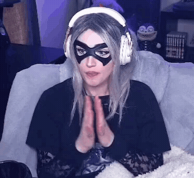 Woman Wearing Headphones And Mask Sitting GIF
