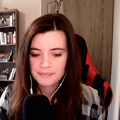 Woman Wearing Headphones And Plaid Shirt At Microphone GIF