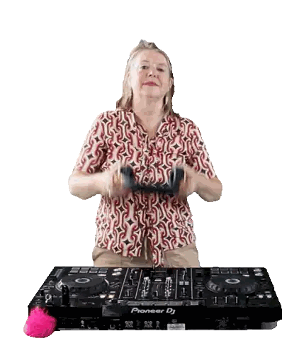 Woman Wearing Headphones In Front Of Pioneer DJ Sticker