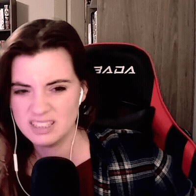 Woman Wearing Headphones In Gaming Chair GIF