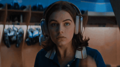 Woman Wearing Headphones Looking At Camera GIF