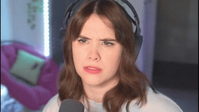 Woman Wearing Headphones Making Funny Face GIF