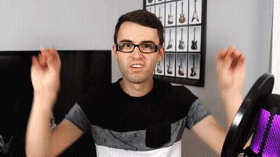 Woman Wearing Headphones Making Funny Face GIF