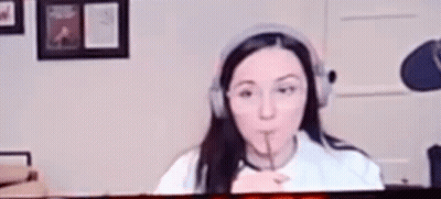 Woman Wearing Headphones Making Funny Face GIF