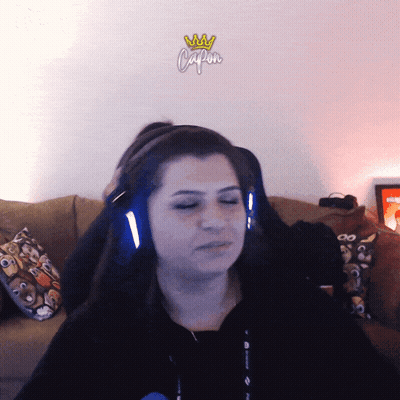 Woman Wearing Headphones Saying Capon GIF