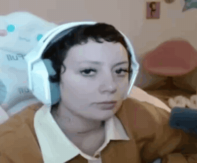 Woman Wearing Headphones Sitting In Chair GIF