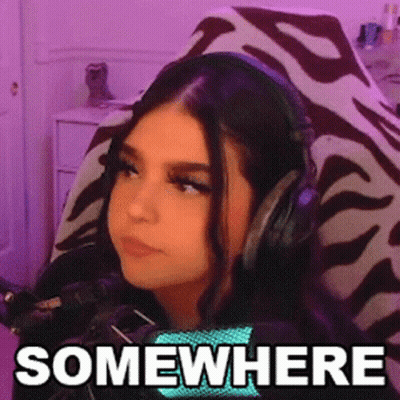 Woman Wearing Headphones Sitting In Chair Saying Somewhere GIF