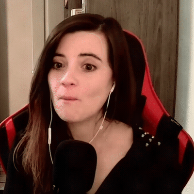 Woman Wearing Headphones Sitting In Red Chair GIF