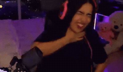 Woman Wearing Headphones Sitting On Couch GIF