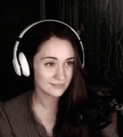 Woman Wearing Headphones Smiling At Microphone GIF