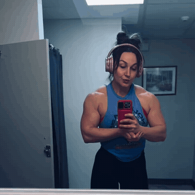 Woman Wearing Headphones Taking Selfie GIF