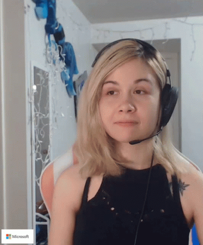 Woman Wearing Headphones With Microsoft Logo GIF