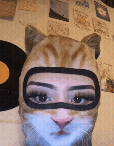Woman Wearing Heart Mask GIF