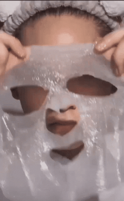 Woman Wearing Heart Mask GIF