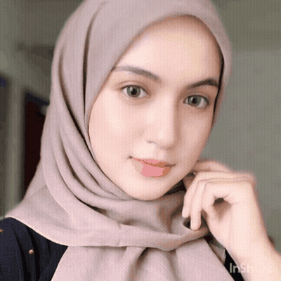 Woman Wearing Hijab Looking At Camera GIF