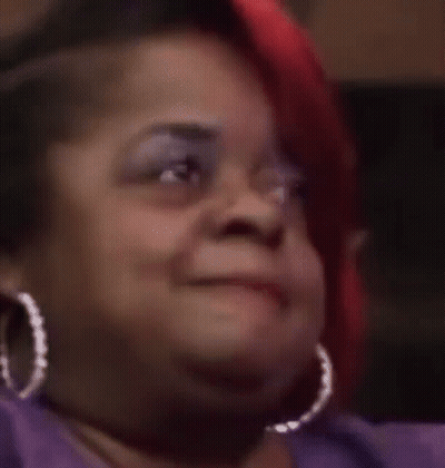 Woman Wearing Hoop Earrings Making Funny Face GIF