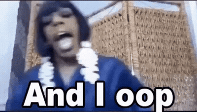 Woman Wearing Lei And Blue Shirt Making Funny Face GIF