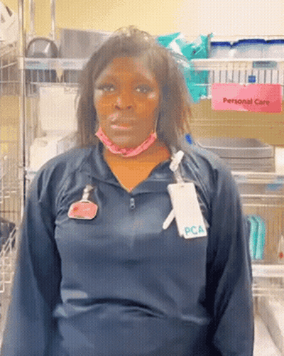 Woman Wearing Mask And PCA Name Tag GIF