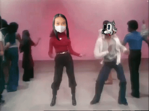 Woman Wearing Mask Dancing With Man Wearing Mask That Says 00 GIF