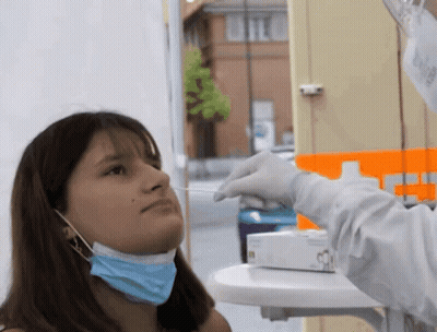 Woman Wearing Mask Getting Swab From Doctor GIF