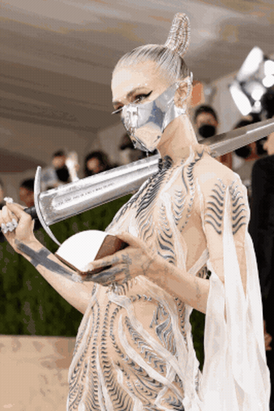 Woman Wearing Mask Holding Sword GIF