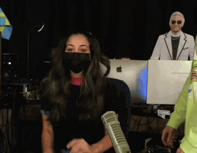 Woman Wearing Mask In Front Of Apple Monitor GIF