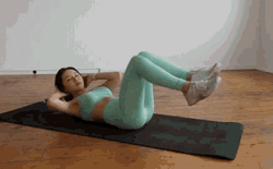 Woman Wearing Mint Green Doing Crunches GIF