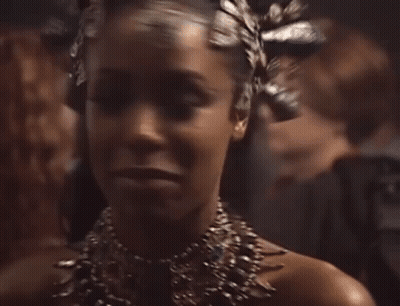 Woman Wearing Necklace And Crown GIF