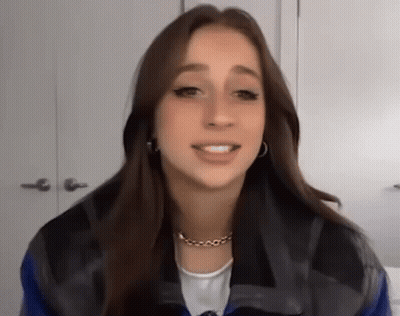 Woman Wearing Necklace And Earrings GIF