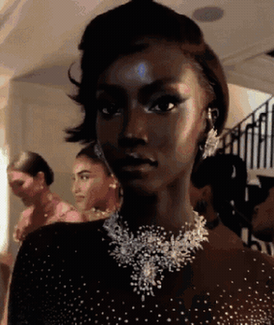 Woman Wearing Necklace And Earrings GIF