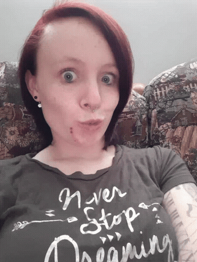 Woman Wearing Never Stop Dreaming Shirt GIF