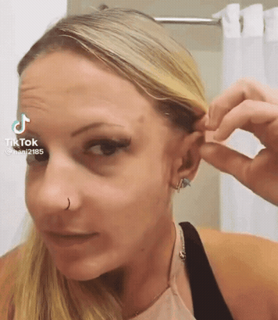 Woman Wearing Nose Ring And Earrings GIF
