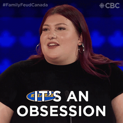 Woman Wearing Obsession Shirt GIF