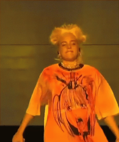 Woman Wearing Orange Shirt With Picture Of Girl GIF