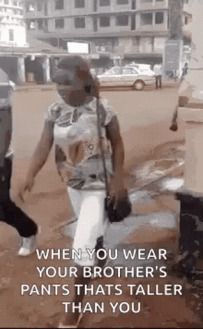 Woman Wearing Pants Taller Than Her GIF