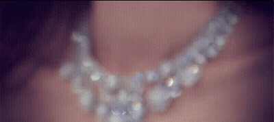 Woman Wearing Pearl Necklace Close Up GIF