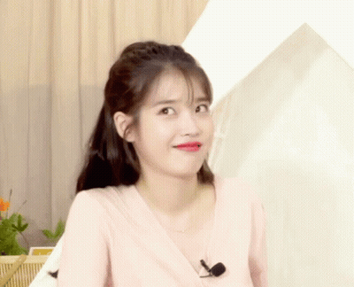 Woman Wearing Pink Shirt And Microphone GIF