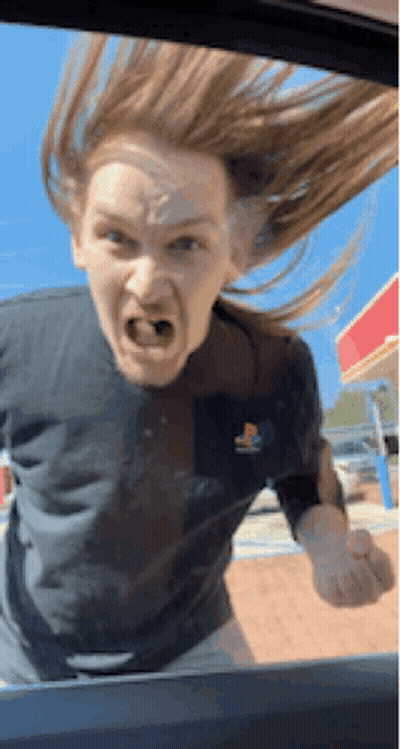 Woman Wearing PlayStation Shirt Making Funny Face GIF