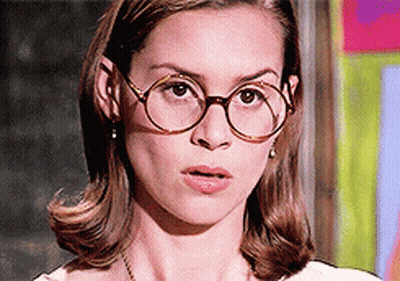 Woman Wearing Round Glasses And Earrings GIF