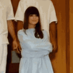 Woman Wearing Straight Jacket Smiling GIF