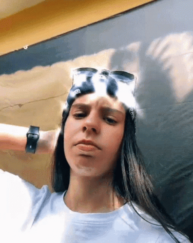 Woman Wearing Sunglasses and Bandana Making Face