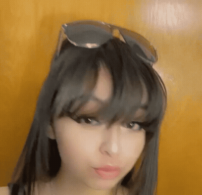 Woman Wearing Sunglasses And Bangs GIF