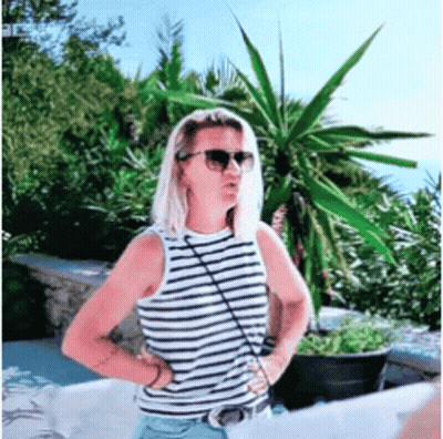 Woman Wearing Sunglasses And Striped Tank Top GIF