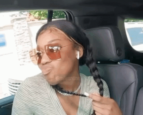 Woman Wearing Sunglasses Sitting In Car GIF