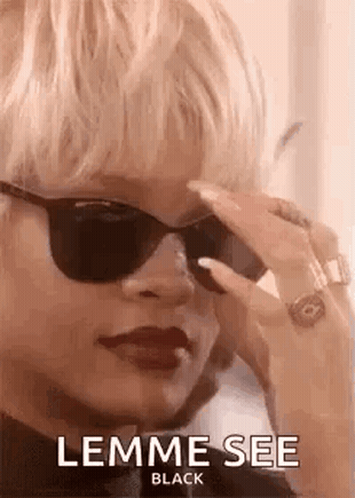 Woman Wearing Sunglasses Talking On Phone GIF