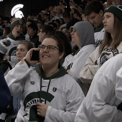 Woman Wearing The Lodge Of Michigan Sweatshirt GIF