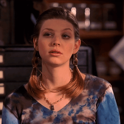 Woman Wearing Tie Dye Top And Necklace GIF