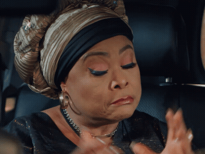 Woman Wearing Turban And Necklace Making A Face GIF