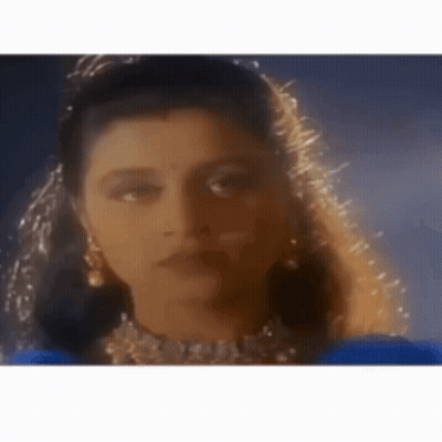 Woman Wearing Veil And Earrings GIF