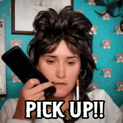 Woman Wearing Wig Talking On Phone GIF